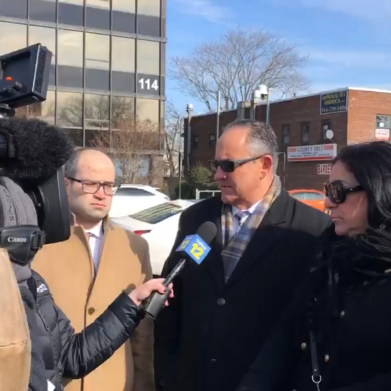 James E. Toner being interviewed on camera by News 12 Long Island